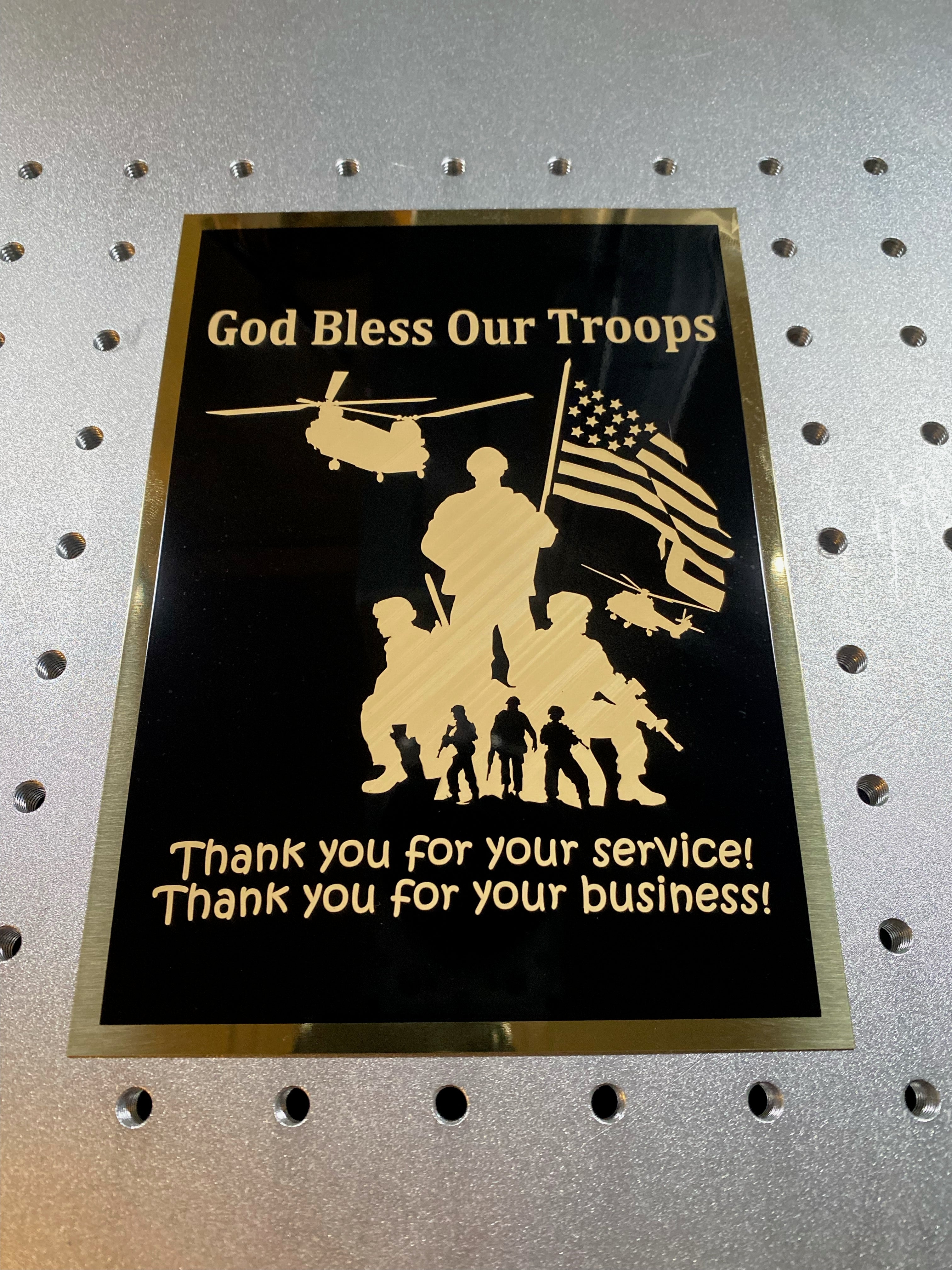 Load video: A video / audio example of a fiber laser engraver etching a patriotic graphic with the words, &quot;God bless our troops.&quot; The bottom reads, &quot;Thank you for your service! Thank you for your business!&quot;